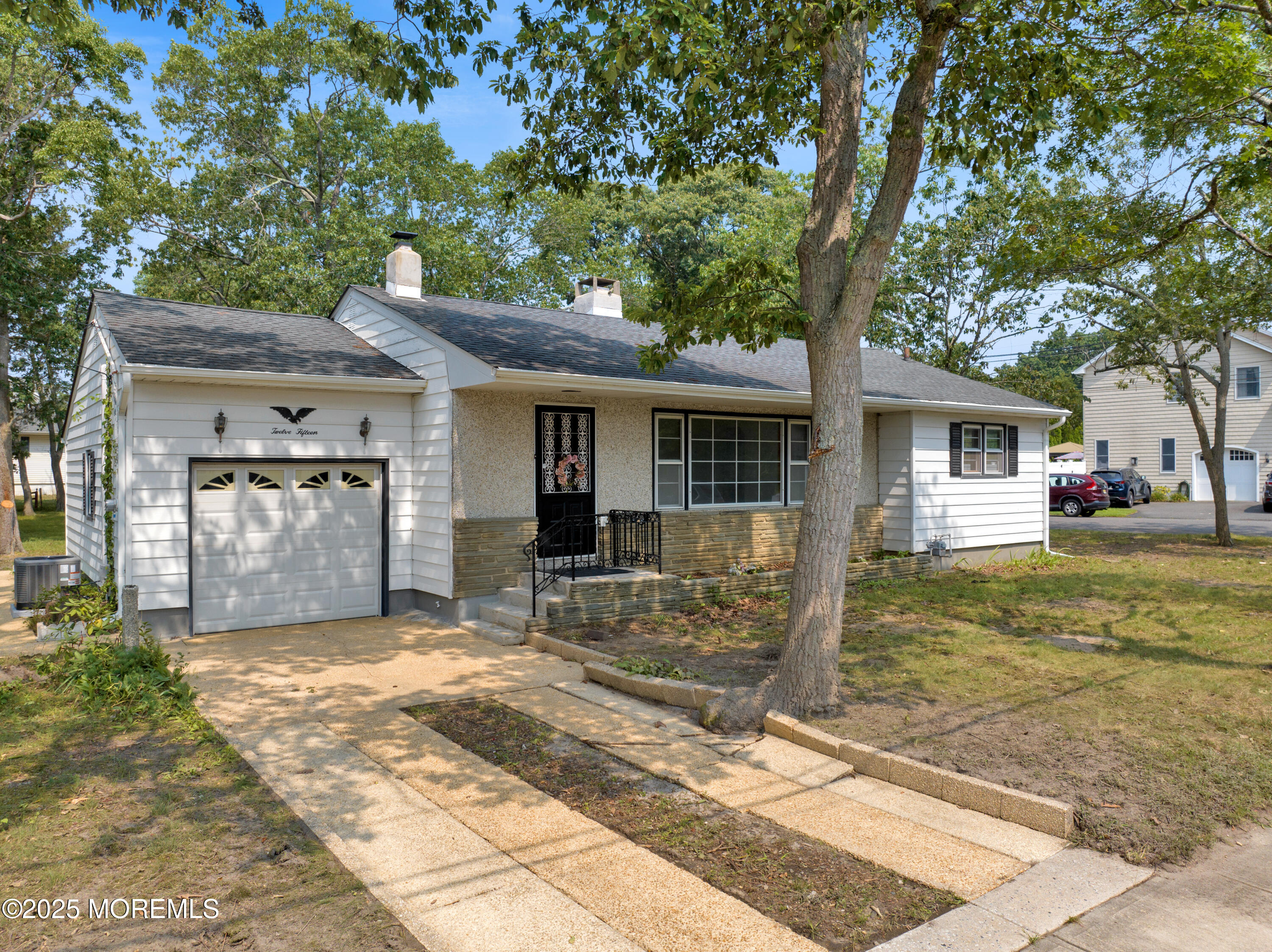 1215 Dorsett Dock Road Point Pleasant, NJ 08742 - Photo 1 of 16 a view of a house with a patio