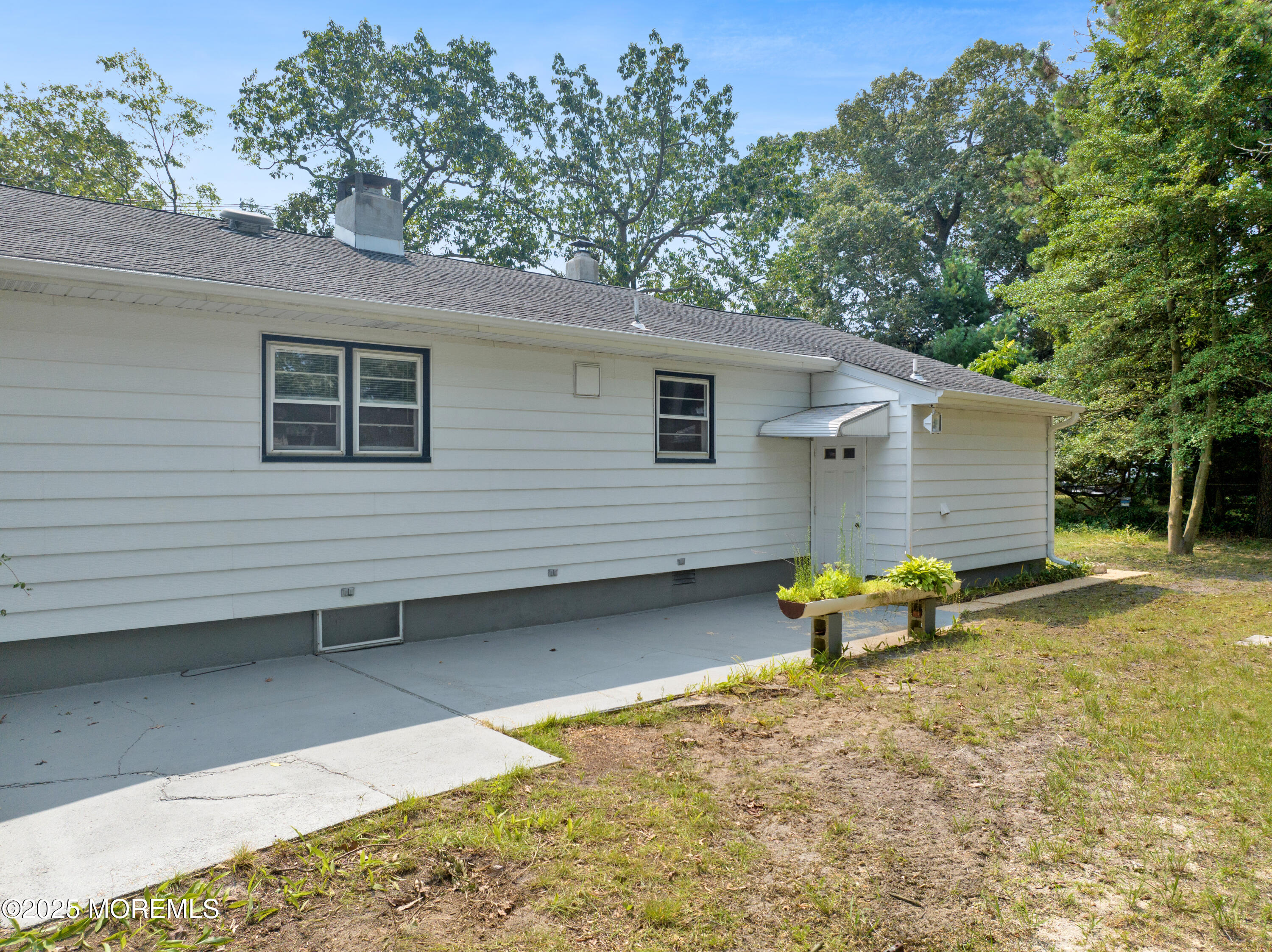 1215 Dorsett Dock Road Point Pleasant, NJ 08742 - Photo 12 of 16 a view of a house with backyard and sitting area