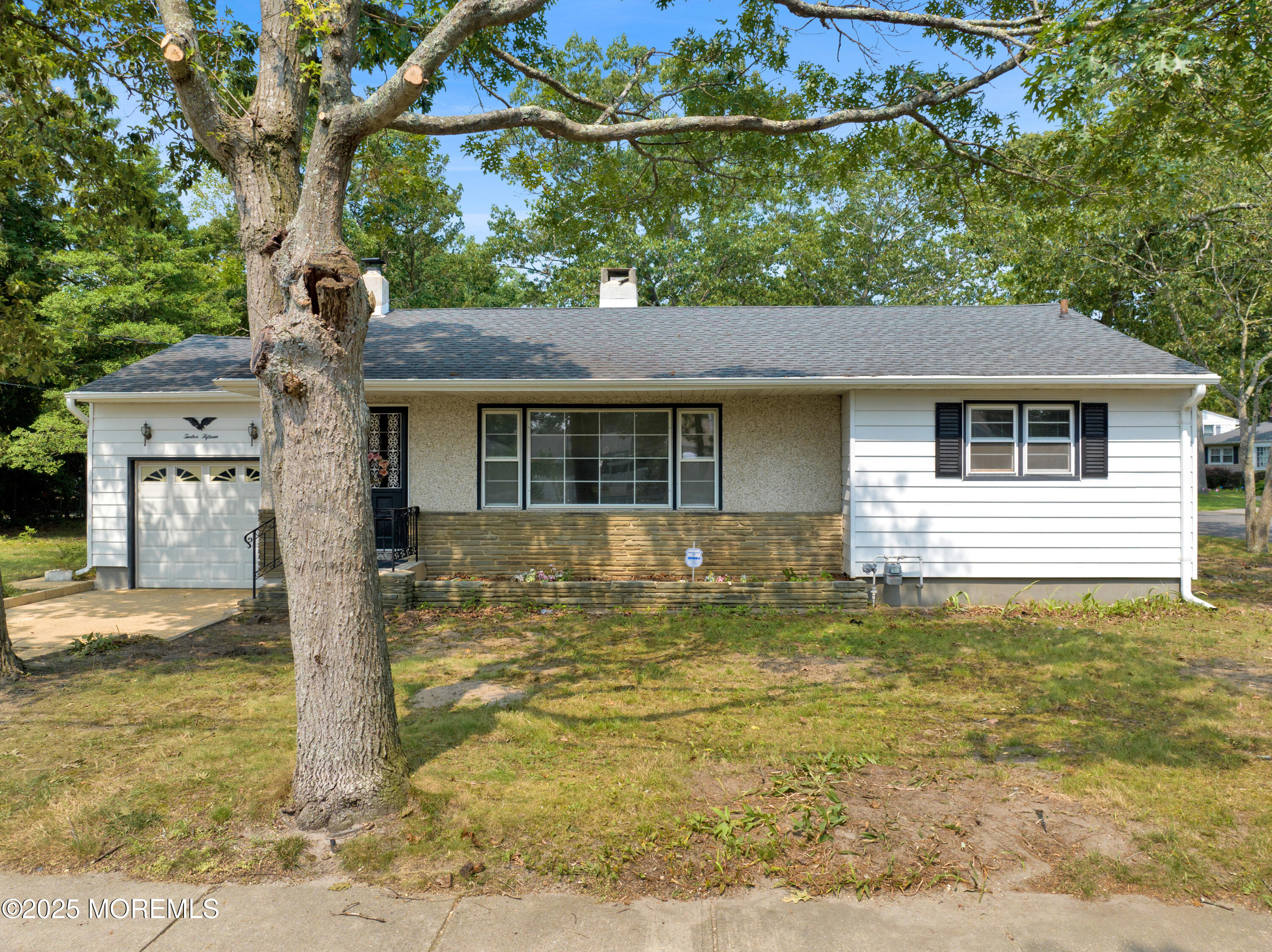 1215 Dorsett Dock Road Point Pleasant, NJ 08742 - Photo 3 of 16 a front view of a house with a garden