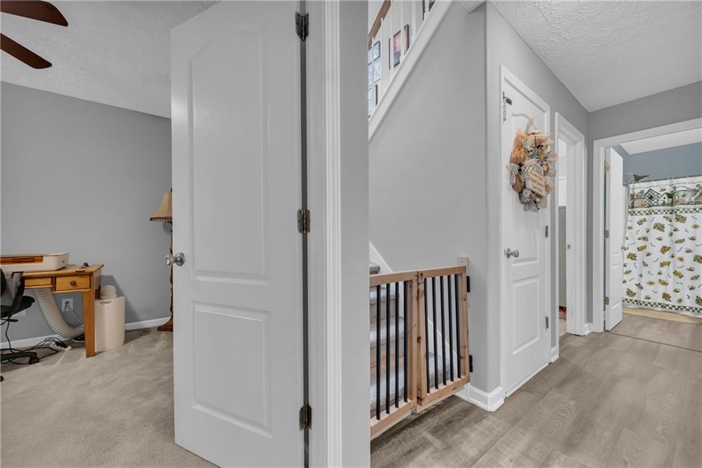 587-j B J B Owens Road Bethlehem, GA 30620 - Photo 46 of 99 a view of a hallway with closet and utility room