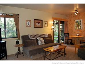 1937 Soda Ridge Road, Unit 1140 Keystone, CO 80435 - Photo 11 of 20 a living room with furniture and a large window