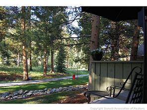 1937 Soda Ridge Road, Unit 1140 Keystone, CO 80435 - Photo 13 of 20 a view of backyard with wooden fence and trees