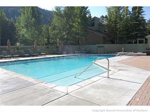 1937 Soda Ridge Road, Unit 1140 Keystone, CO 80435 - Photo 18 of 20 a view of a swimming pool with a yard