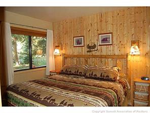 1937 Soda Ridge Road, Unit 1140 Keystone, CO 80435 - Photo 7 of 20 a bed sitting in a bedroom next to a window