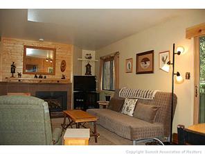 1937 Soda Ridge Road, Unit 1140 Keystone, CO 80435 - Photo 8 of 20 a living room with furniture and a flat screen tv