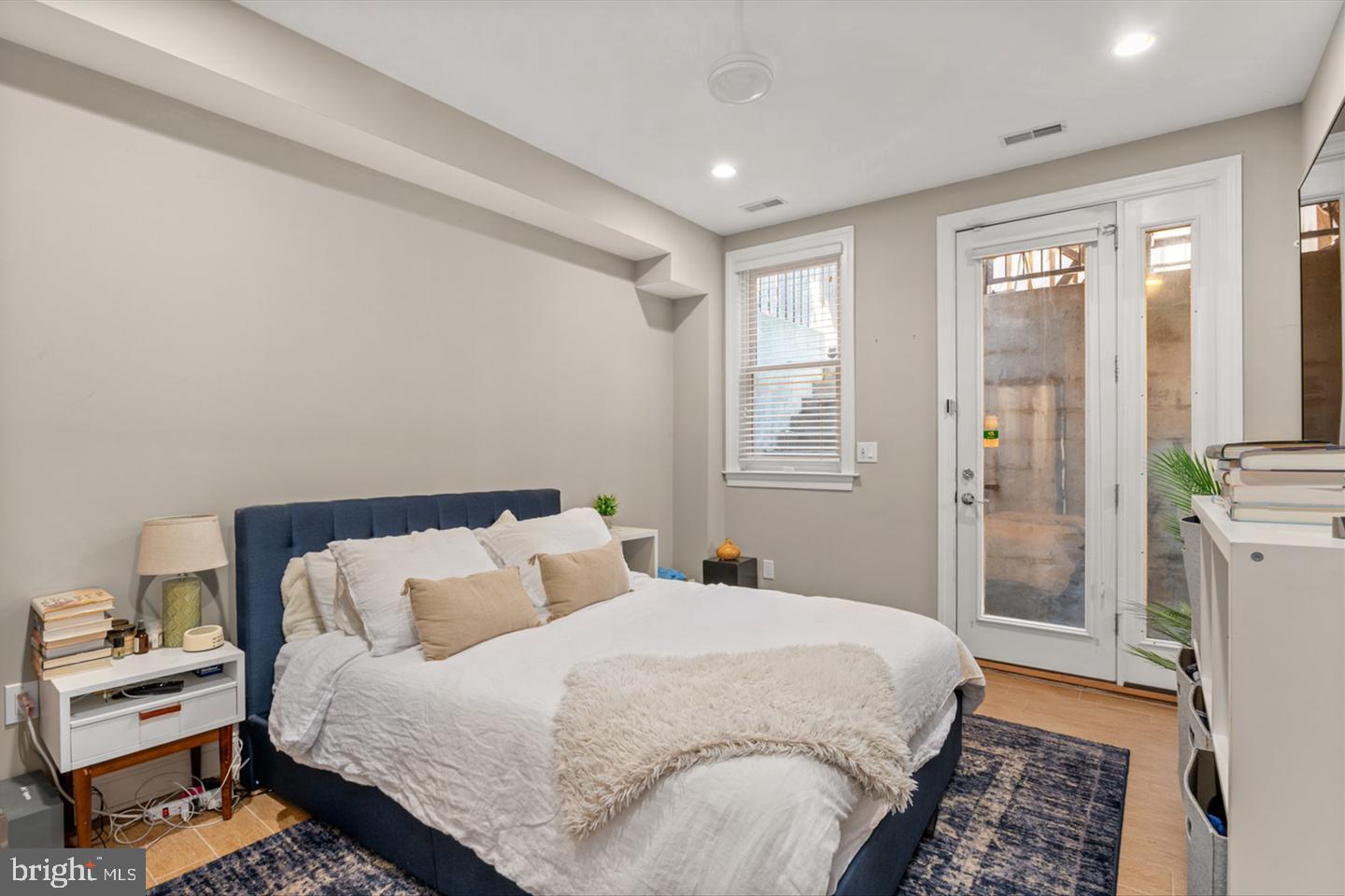 1431 Corcoran Street Northwest, Unit 1 Washington, DC 20009 - Photo 11 of 14 a bedroom with a bed and a window