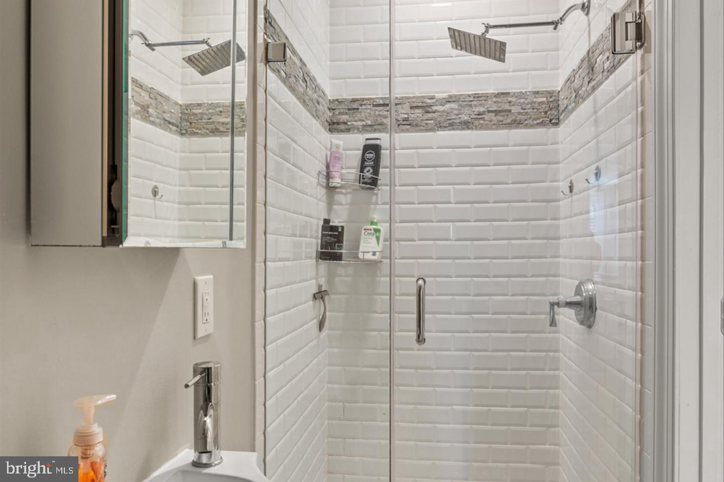 1431 Corcoran Street Northwest, Unit 1 Washington, DC 20009 - Photo 13 of 14 a bathroom with a shower