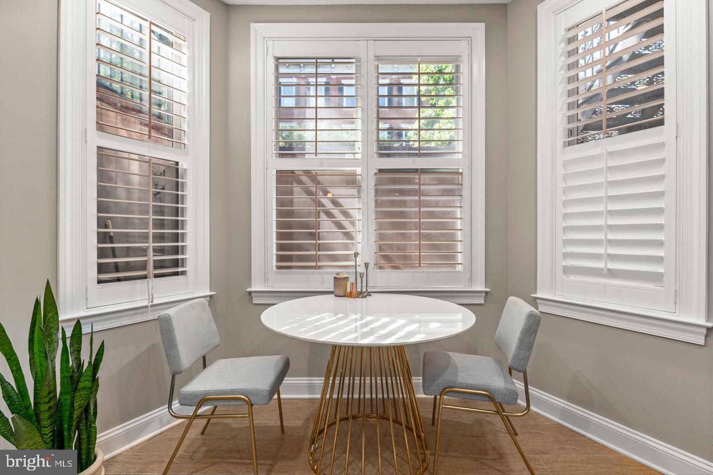 1431 Corcoran Street Northwest, Unit 1 Washington, DC 20009 - Photo 5 of 14 a view of a dining room with furniture and window