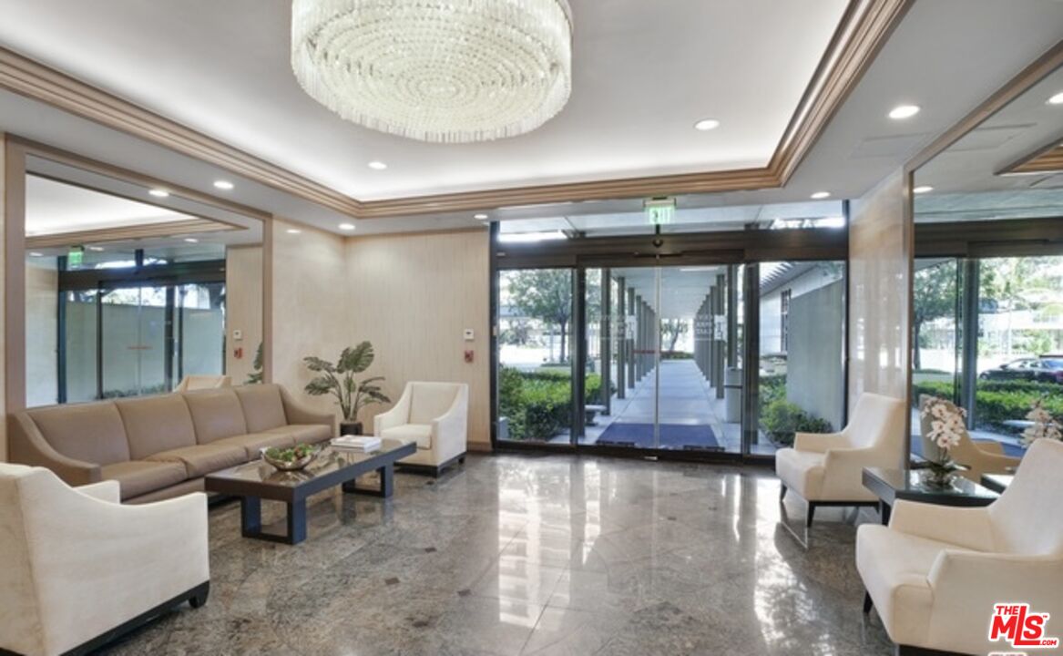 2170 Century Park East, Unit 1507 Los Angeles, CA 90067 - Photo 11 of 17 a living room with furniture and a large window