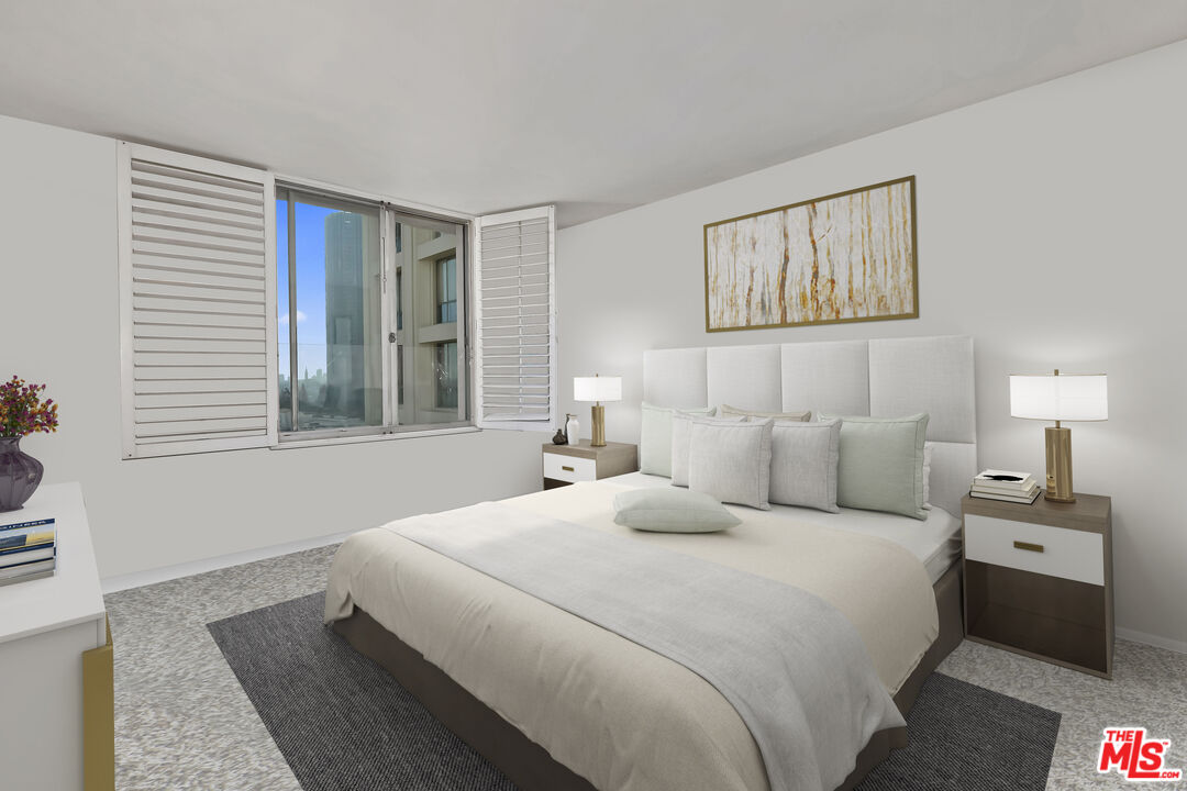 2170 Century Park East, Unit 1507 Los Angeles, CA 90067 - Photo 5 of 17 a bedroom with a large bed and a window