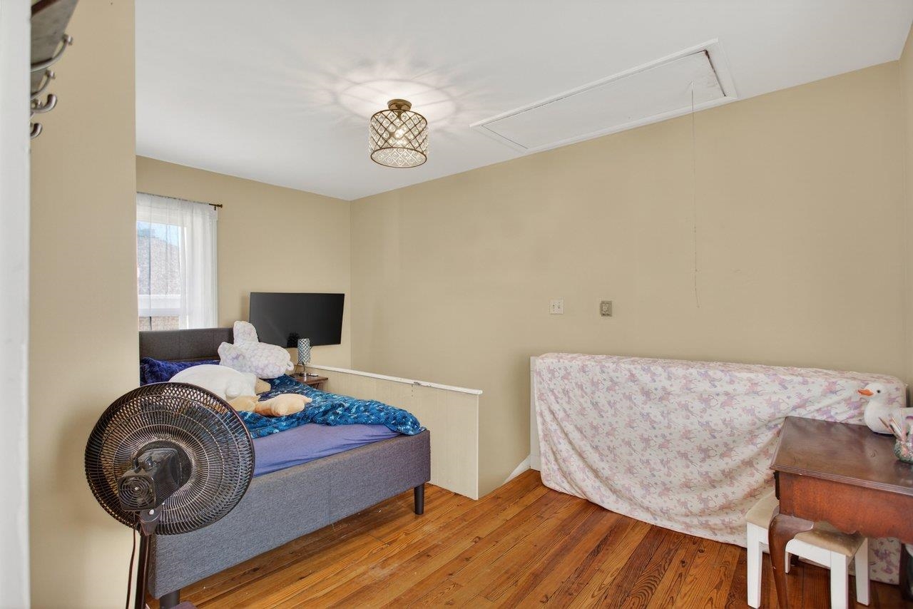 420 West Spring Street Woodstock, VA 22664 - Photo 43 of 67 a bed room with a bed and a chair