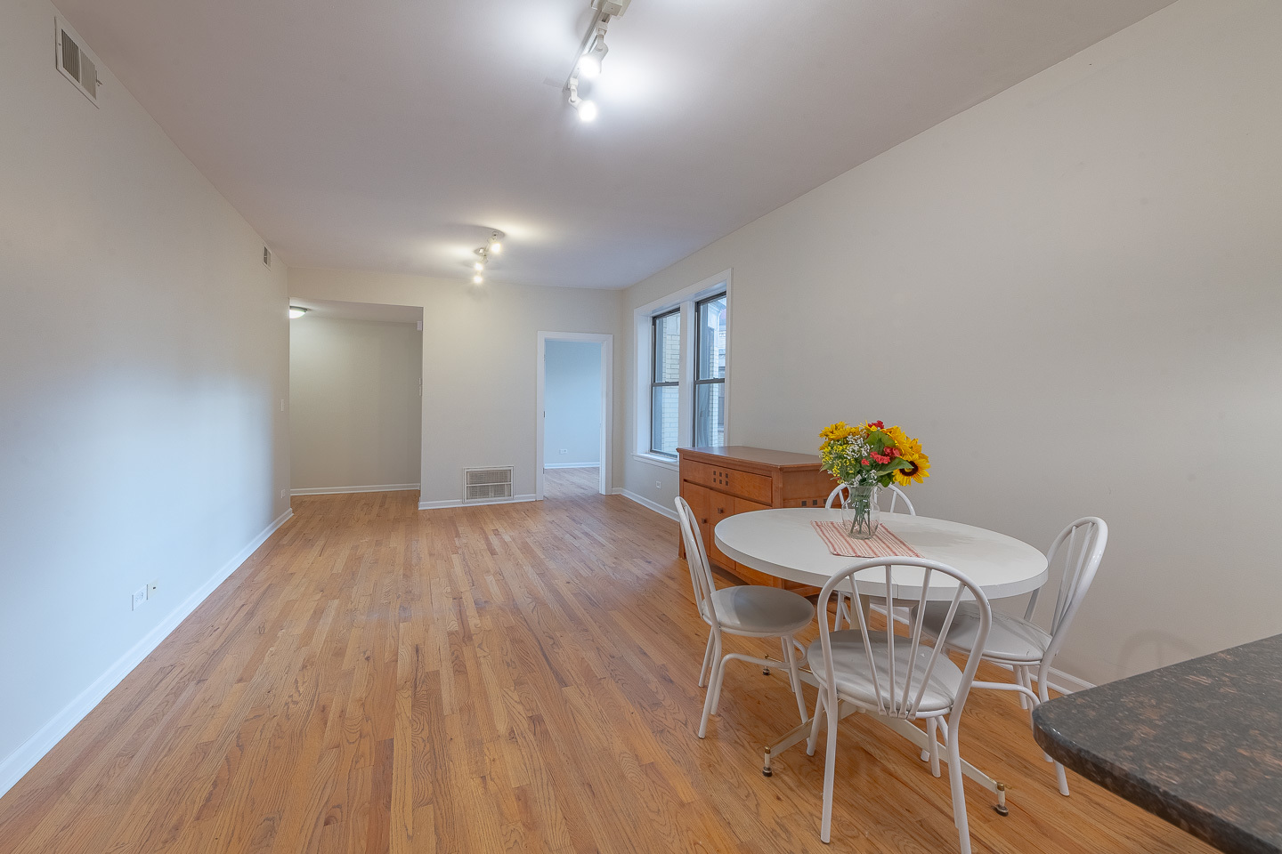 5223 South Drexel Avenue, Unit 2N Chicago, IL 60615 - Photo 14 of 27 a view of a dining room with furniture and wooden floor