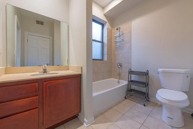 a bathroom with a sink a toilet and bathtub