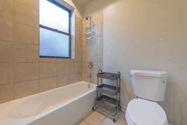 a bathroom with a toilet bathtub and sink