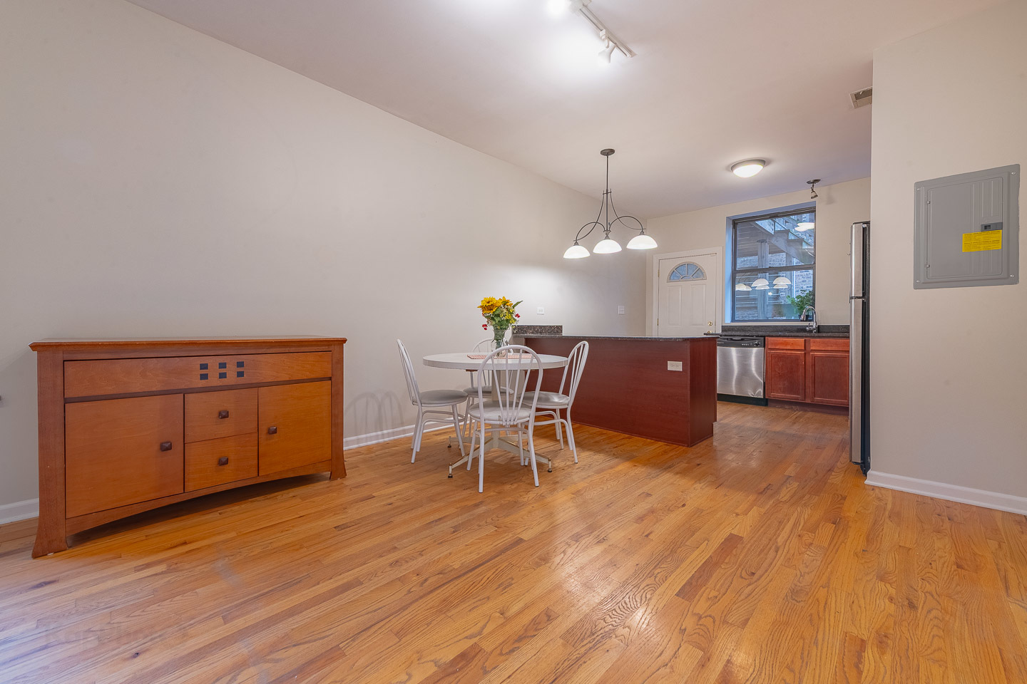 5223 South Drexel Avenue, Unit 2N Chicago, IL 60615 - Photo 5 of 27 a view of a dining room with furniture and wooden floor