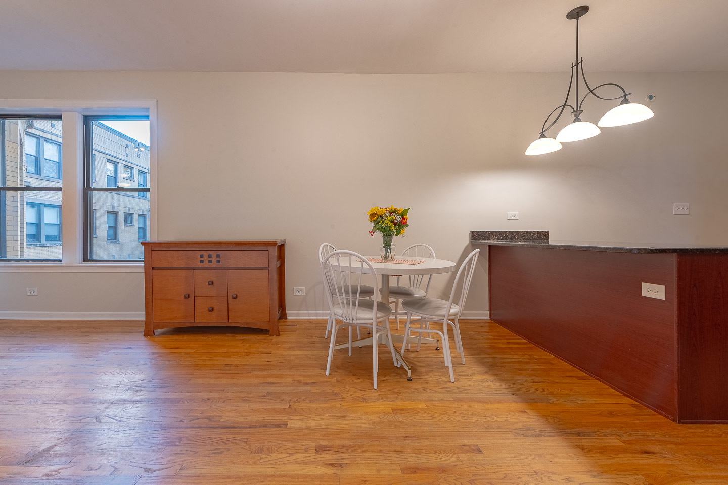 5223 South Drexel Avenue, Unit 2N Chicago, IL 60615 - Photo 6 of 27 a view of a dining room with furniture and wooden floor