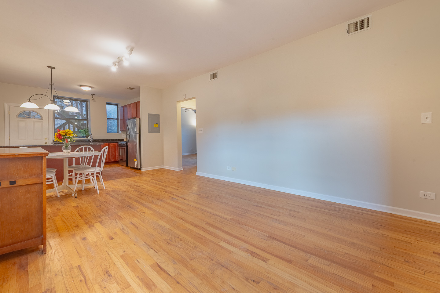 5223 South Drexel Avenue, Unit 2N Chicago, IL 60615 - Photo 8 of 27 a view of a dining room with furniture and wooden floor