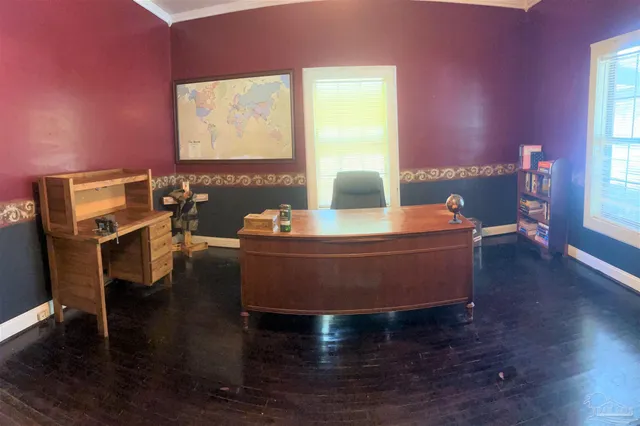 a room with wooden floor and tables