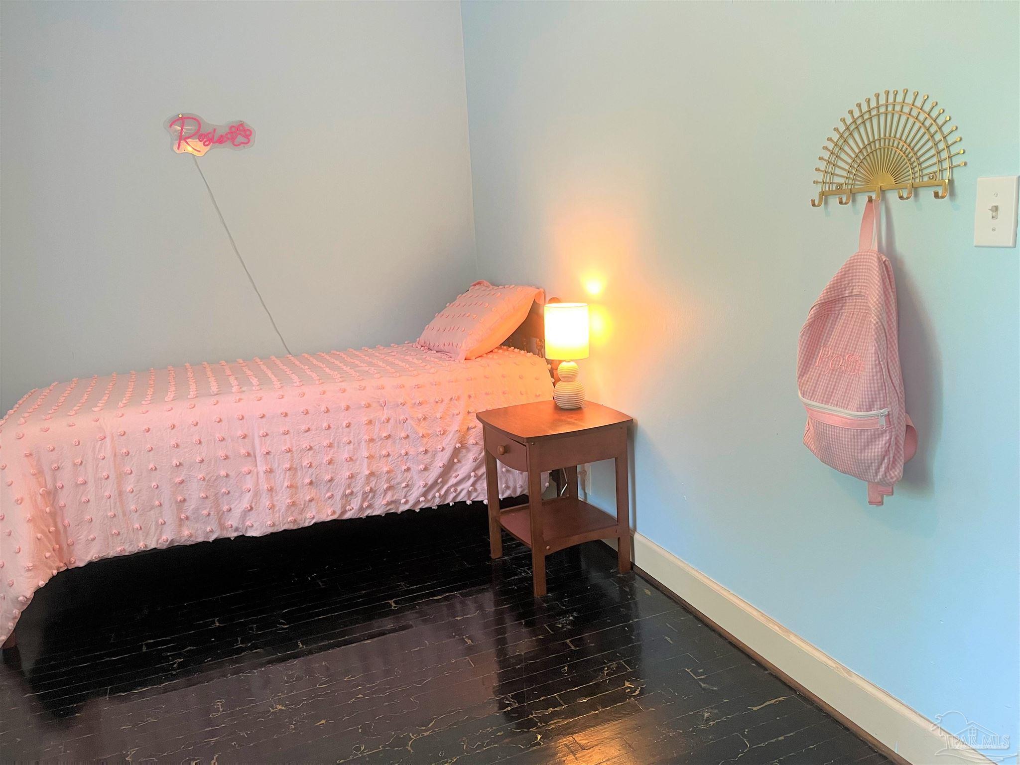 77 Hill Street Atmore, AL 36502 - Photo 28 of 30 a bedroom with a bed and a dresser