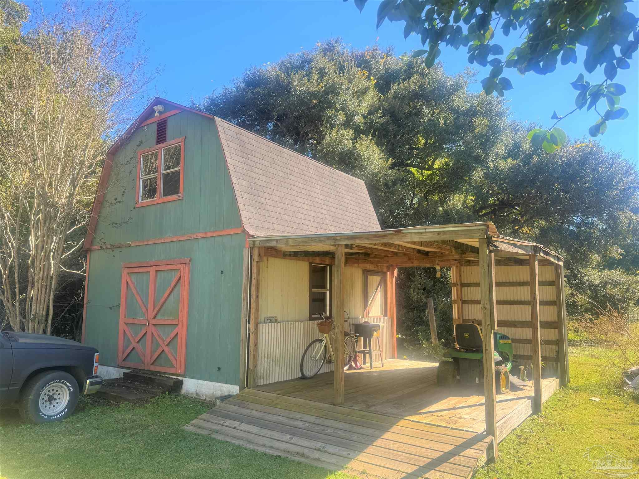 77 Hill Street Atmore, AL 36502 - Photo 7 of 30 a front view of a house with garden