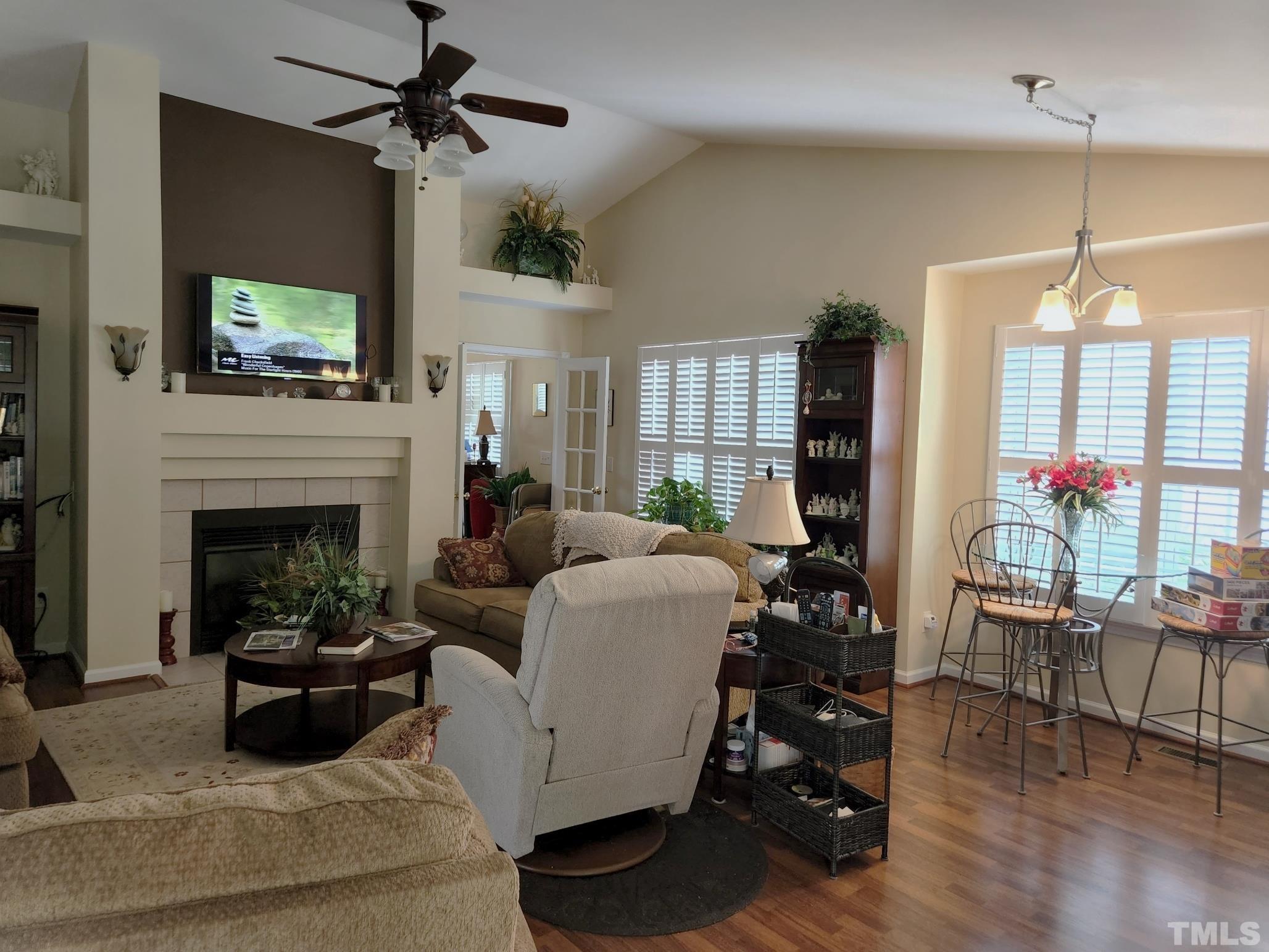 307 Latta Circle Durham, NC 27712 - Photo 11 of 37 a living room with furniture a flat screen tv and a fireplace