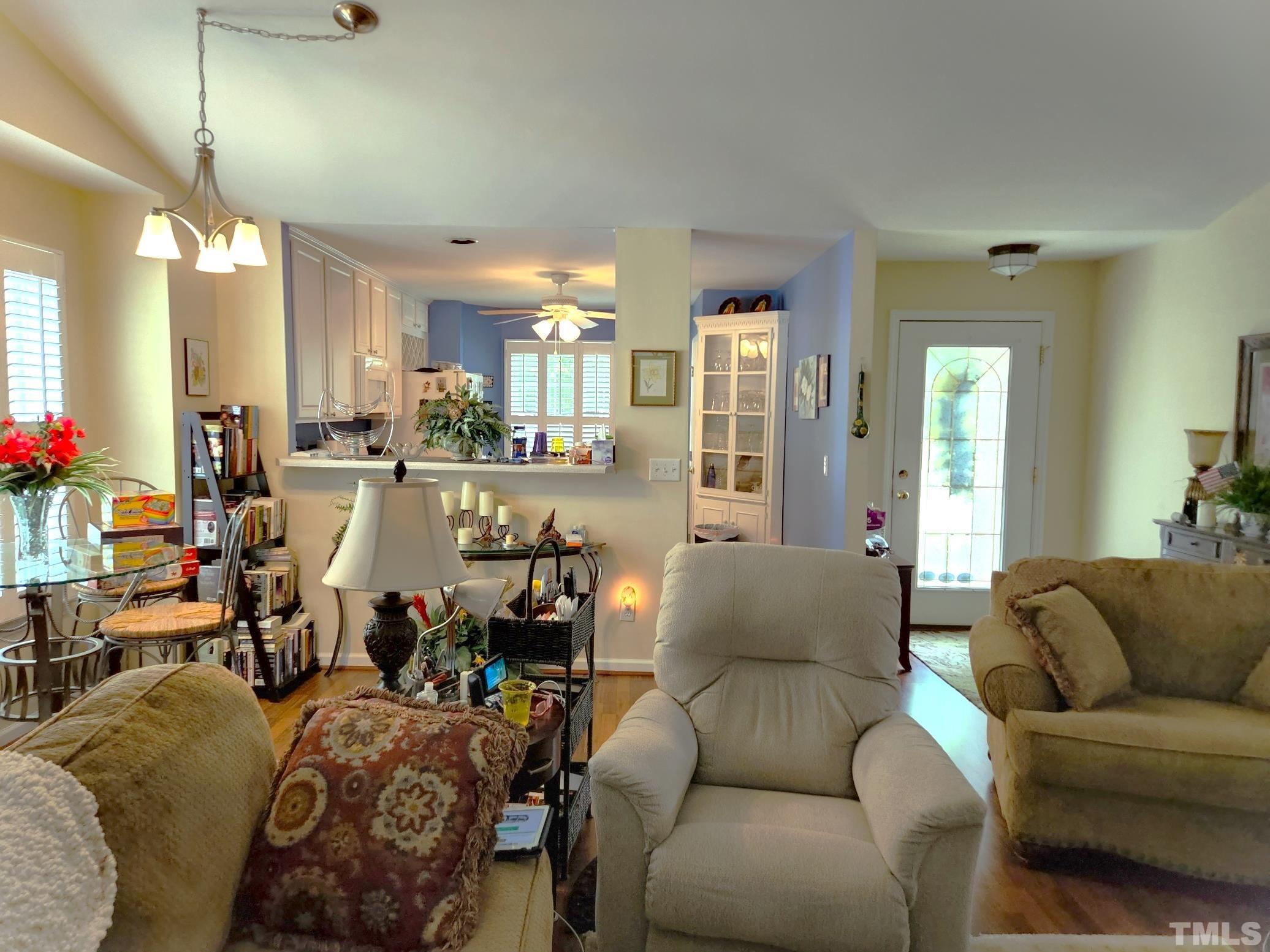 307 Latta Circle Durham, NC 27712 - Photo 12 of 37 a living room with furniture and a chandelier