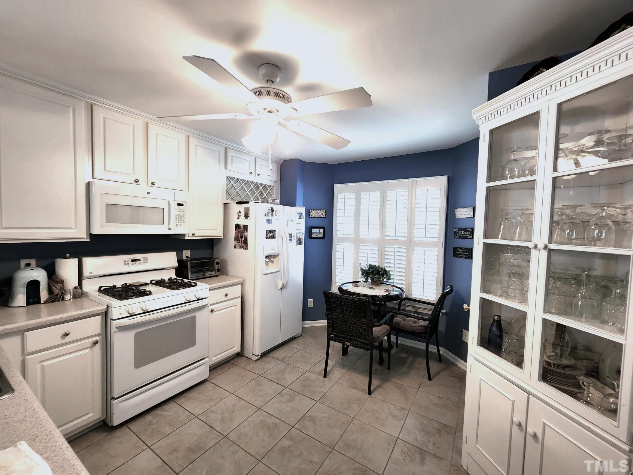 307 Latta Circle Durham, NC 27712 - Photo 13 of 37 a kitchen with cabinets and chairs