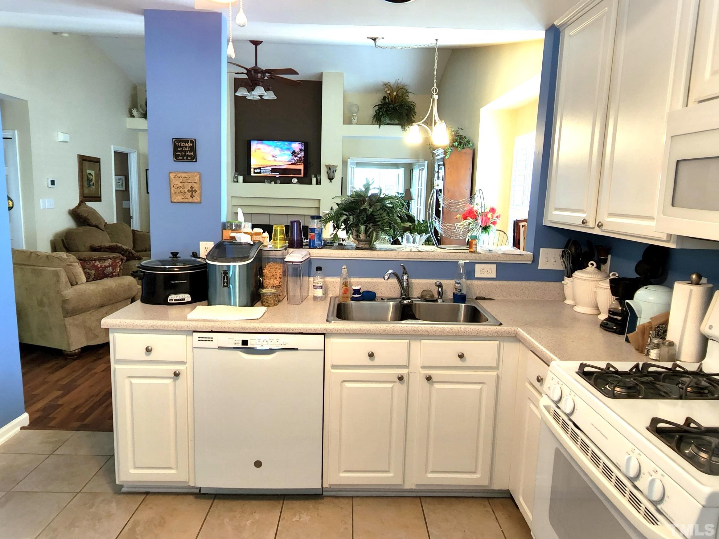 307 Latta Circle Durham, NC 27712 - Photo 15 of 37 a kitchen with cabinets and white appliances