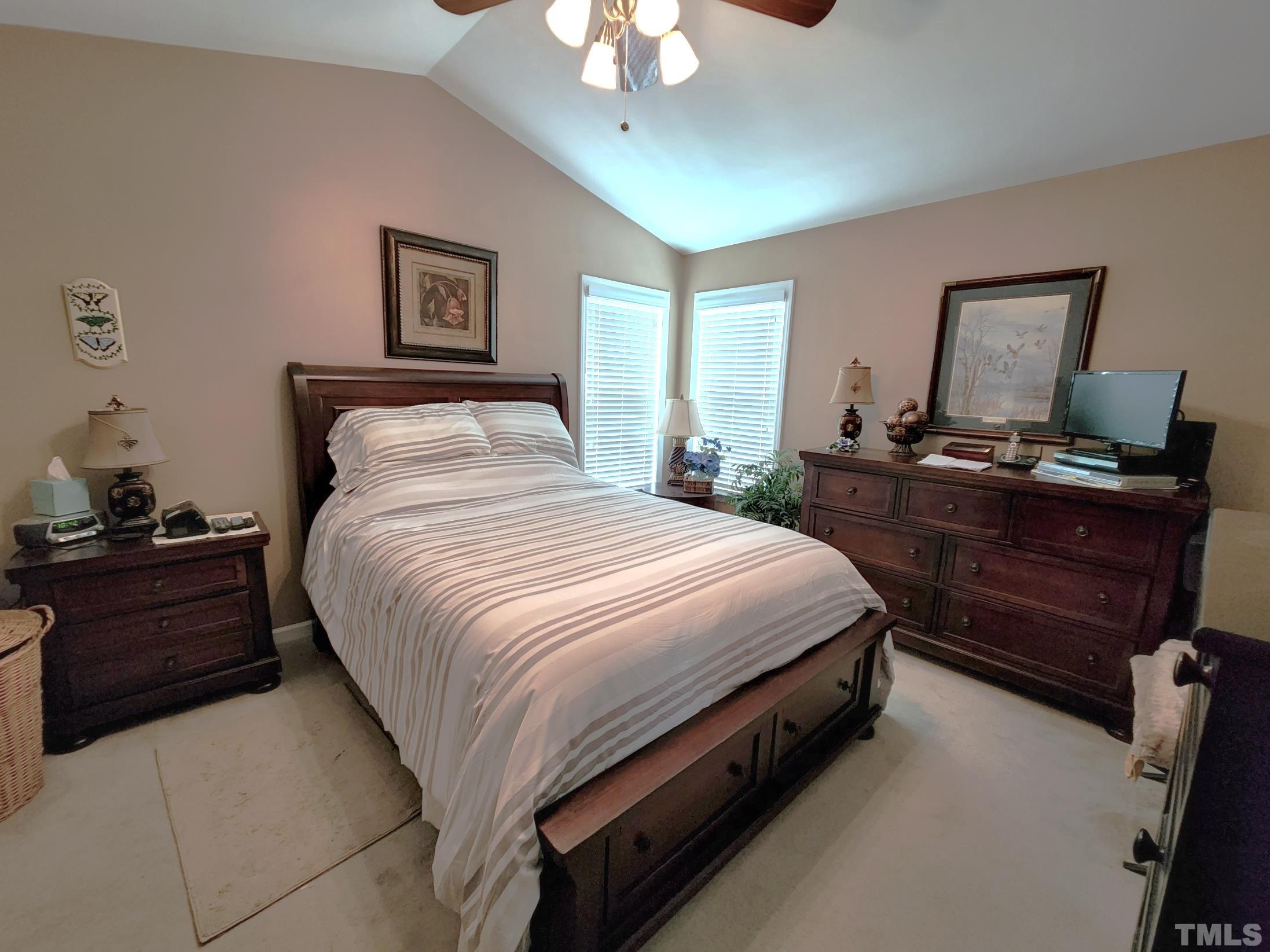 307 Latta Circle Durham, NC 27712 - Photo 17 of 37 a bed room with a bed and a chandelier