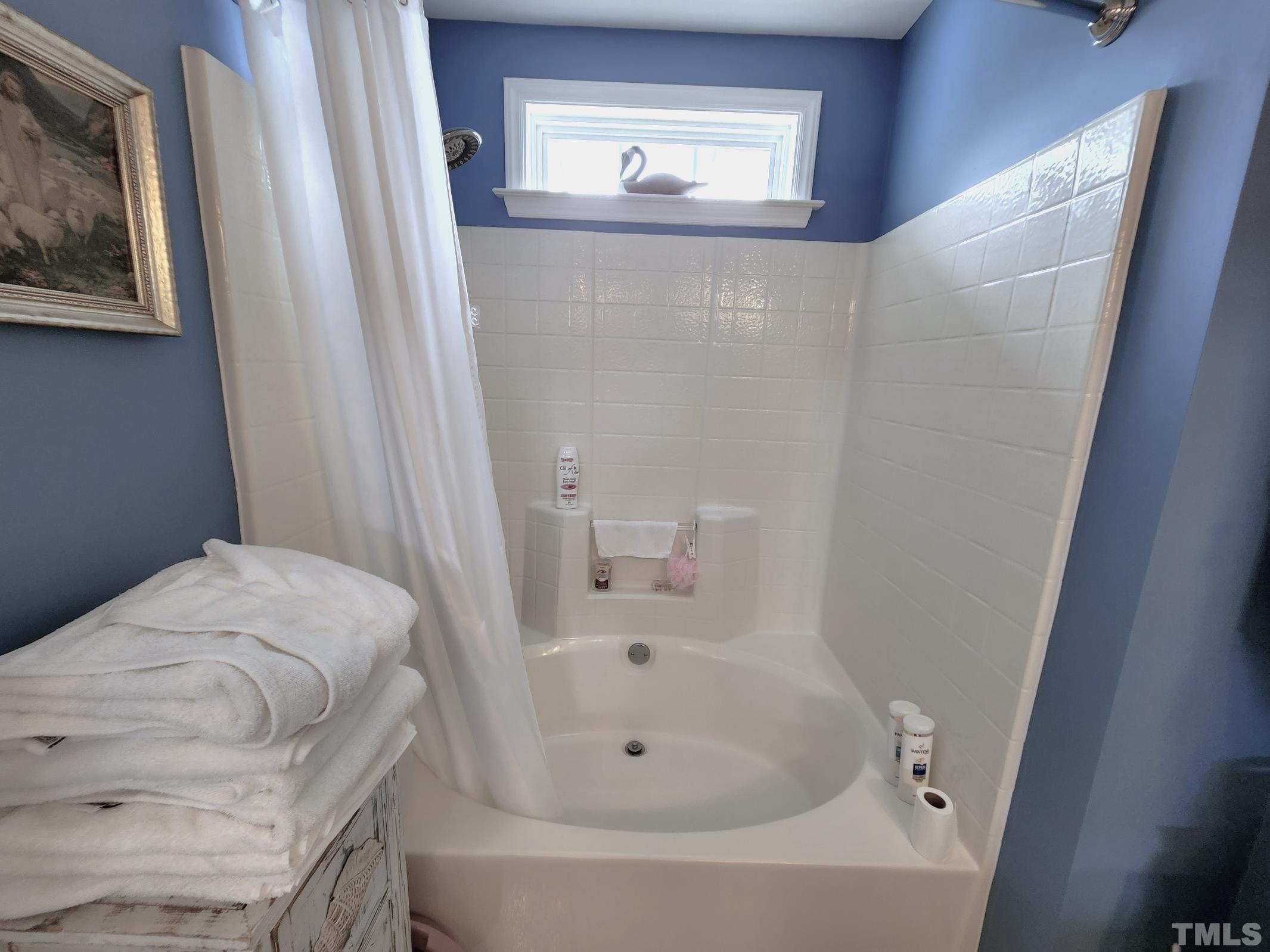 307 Latta Circle Durham, NC 27712 - Photo 21 of 37 a bathroom with a bathtub and a sink