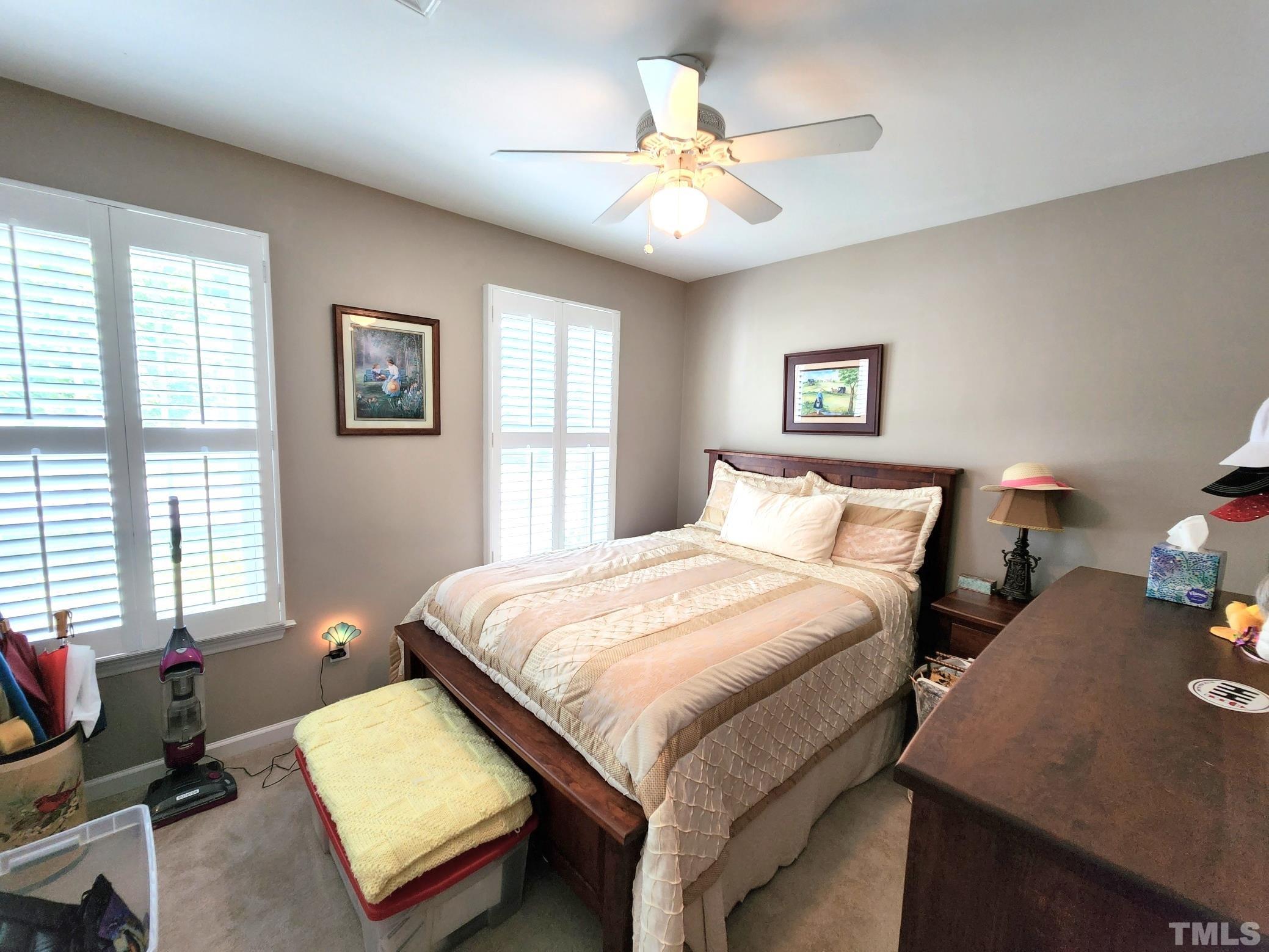 307 Latta Circle Durham, NC 27712 - Photo 22 of 37 a bedroom with a bed and a chandelier