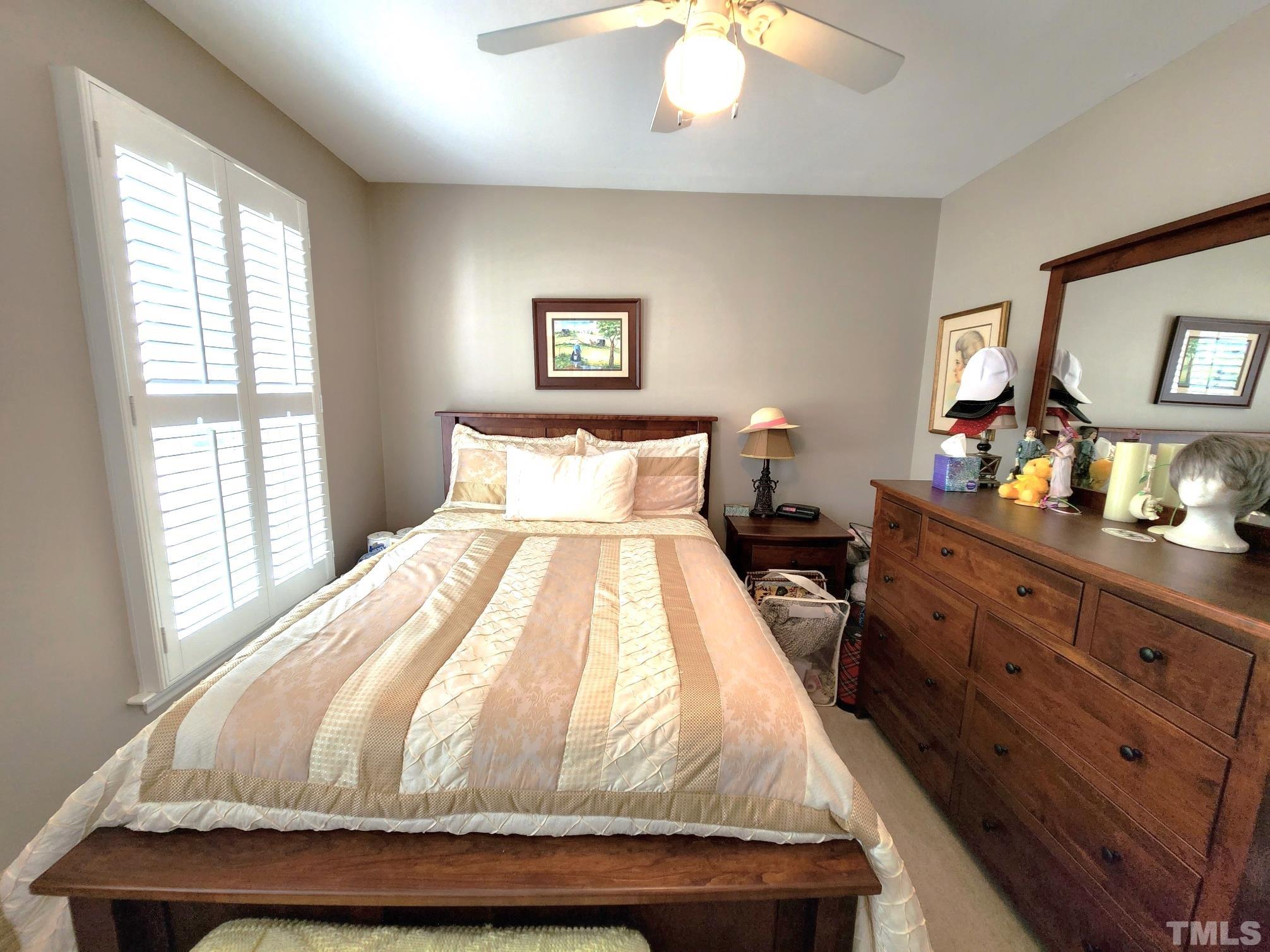 307 Latta Circle Durham, NC 27712 - Photo 23 of 37 a bedroom with a bed and a dresser