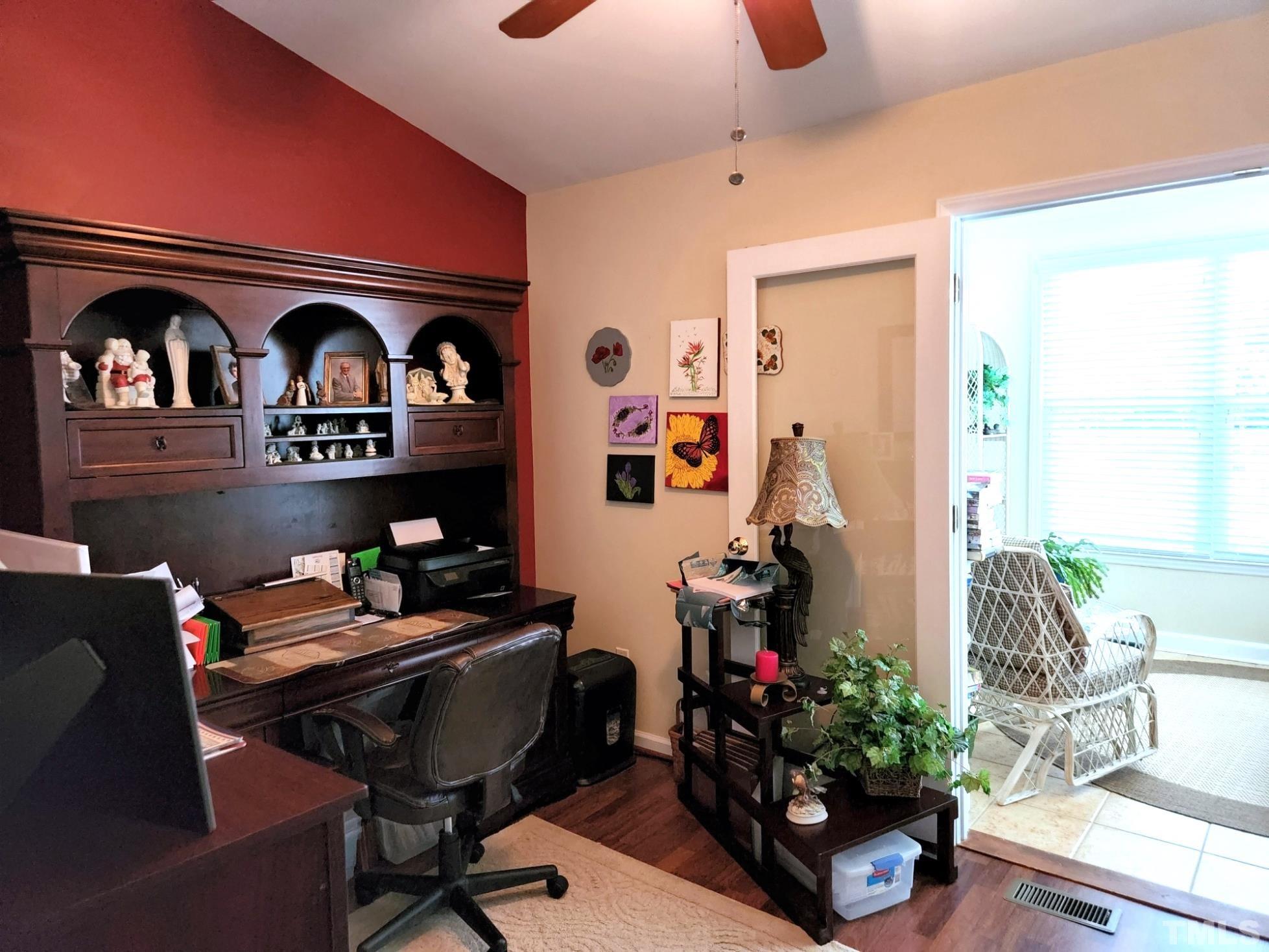 307 Latta Circle Durham, NC 27712 - Photo 25 of 37 a room with furniture and a wooden floor