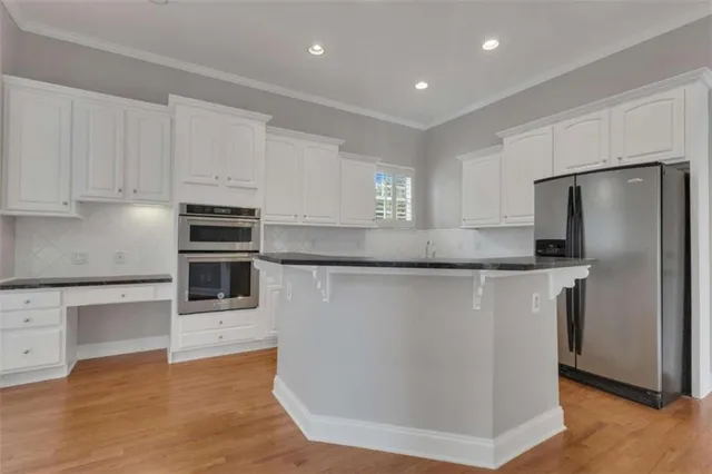 a view of an empty room with a fireplace and a window