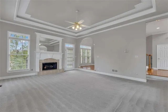 an empty room with a empty space and windows