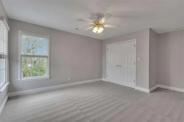 a view of a hallway with wooden shelves
