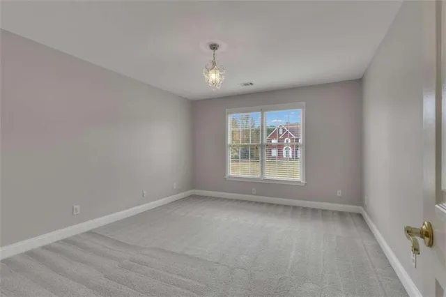 a view of a street with a building in the background