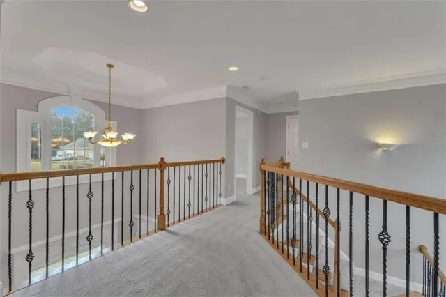 a view of a house with a yard and palm trees