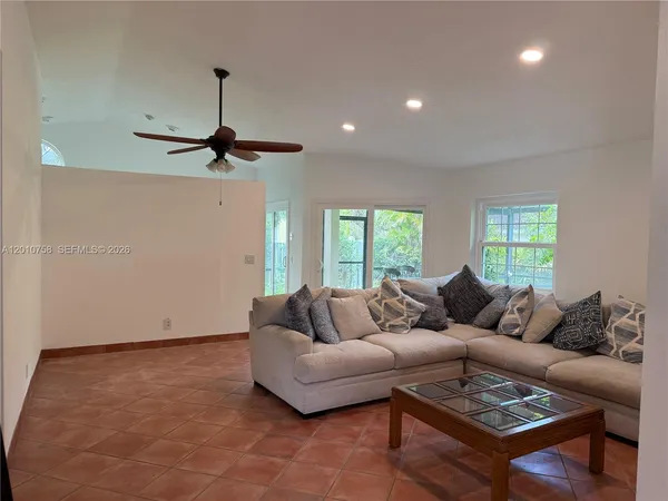 a living room with furniture and a window