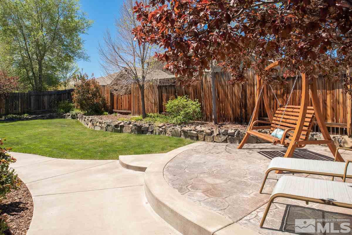 9917 Rio Bravo Drive Reno, NV 89521 - Photo 21 of 36 a view of a backyard with sitting area
