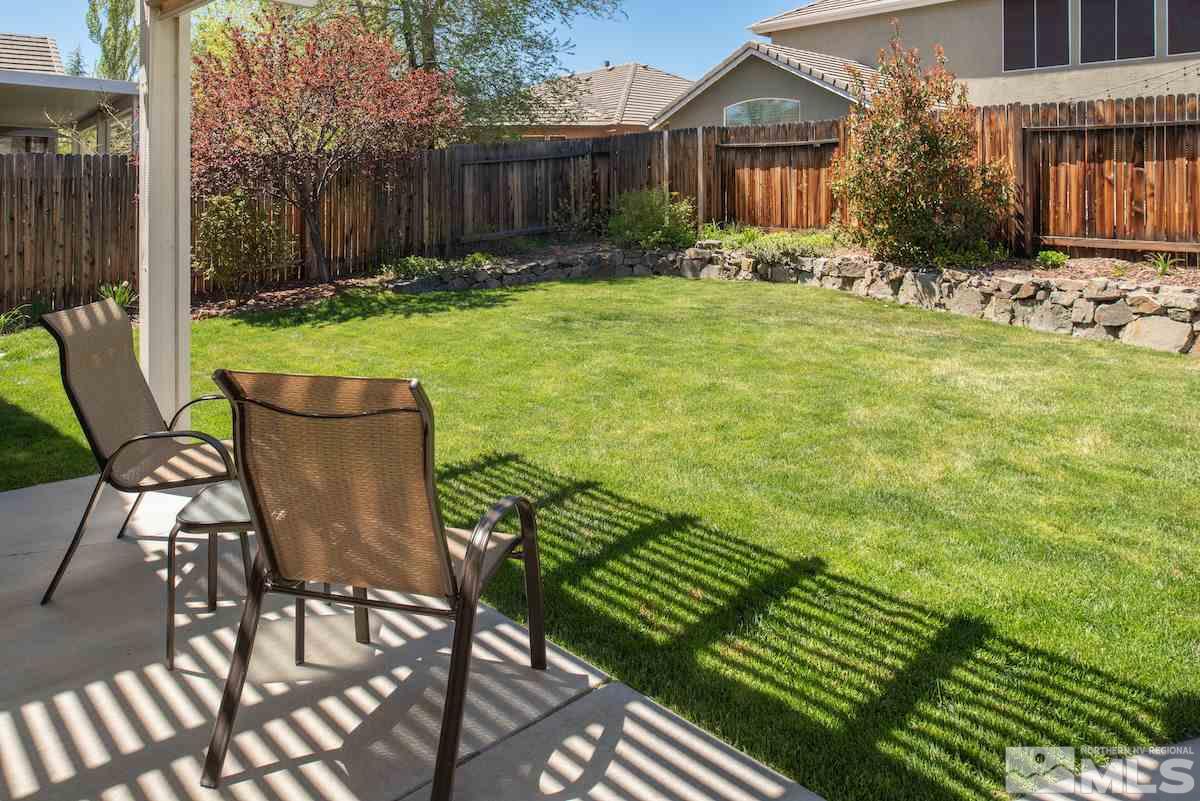 9917 Rio Bravo Drive Reno, NV 89521 - Photo 22 of 36 a view of a chair and table in backyard of the house