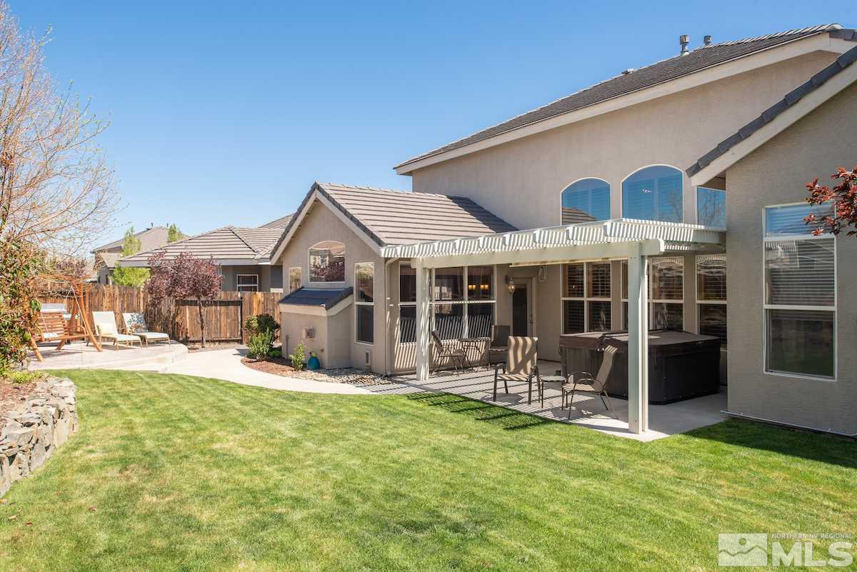 9917 Rio Bravo Drive Reno, NV 89521 - Photo 24 of 36 a view of a house with backyard porch and sitting area