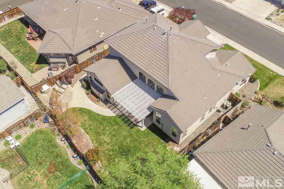 9917 Rio Bravo Drive Reno, NV 89521 - Photo 25 of 36 a view of a house with a backyard