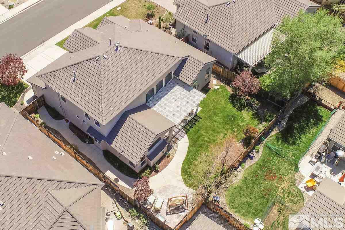 9917 Rio Bravo Drive Reno, NV 89521 - Photo 27 of 36 an aerial view of a house with a garden and deck