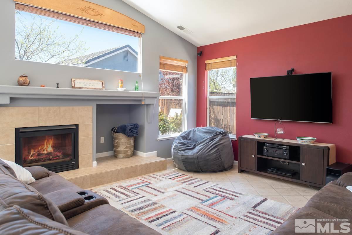 9917 Rio Bravo Drive Reno, NV 89521 - Photo 6 of 36 a living room with furniture and a flat screen tv