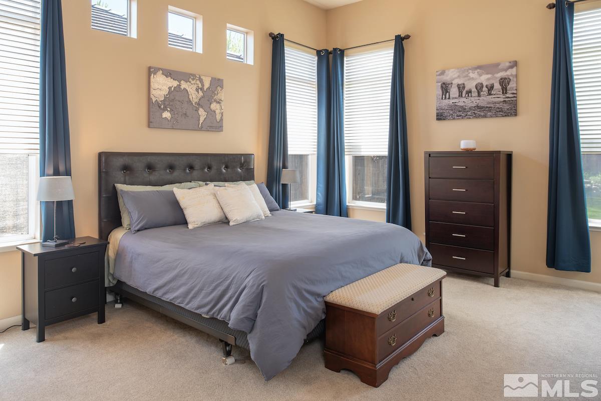 9917 Rio Bravo Drive Reno, NV 89521 - Photo 10 of 36 a bedroom with a bed and a dresser