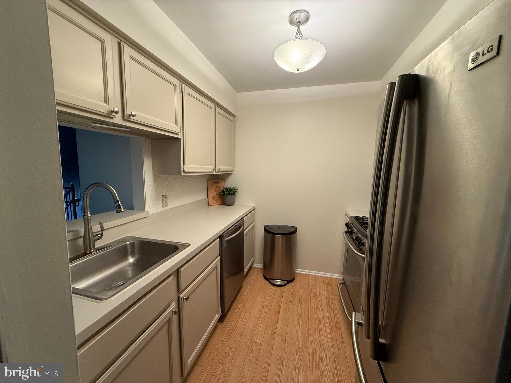 36 Gena Court Hamilton, NJ 08690 - Photo 2 of 15 a kitchen with stainless steel appliances a sink stove and refrigerator