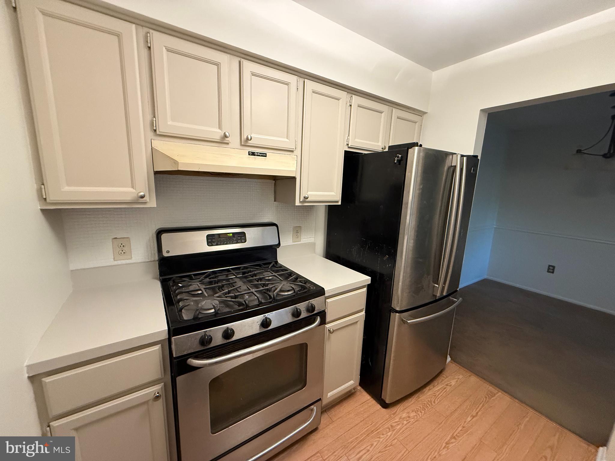 36 Gena Court Hamilton, NJ 08690 - Photo 5 of 15 a kitchen with stainless steel appliances granite countertop a refrigerator stove and cabinets
