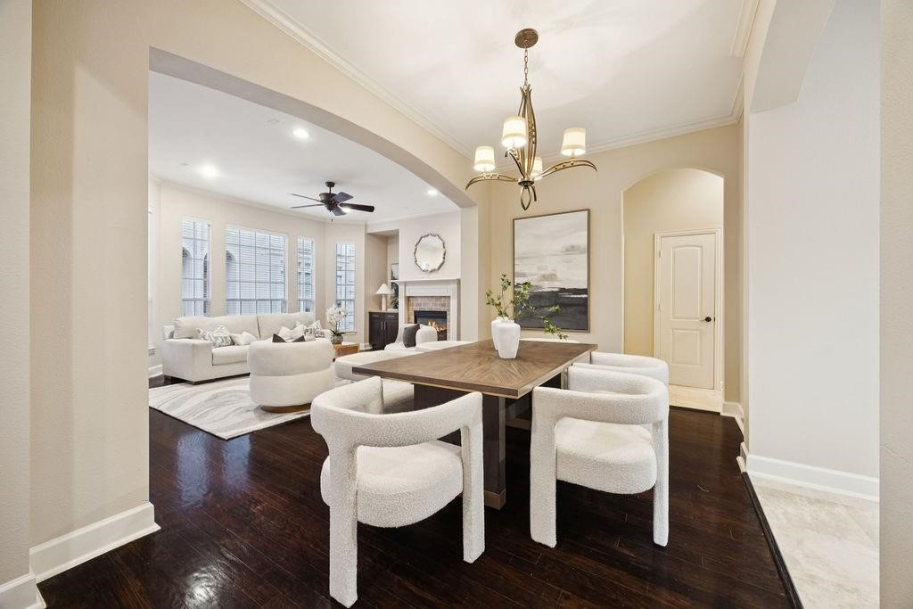 5407 Lillian Street Houston, TX 77007 - Photo 14 of 38 a view of a dining room with furniture wooden floor and chandelier