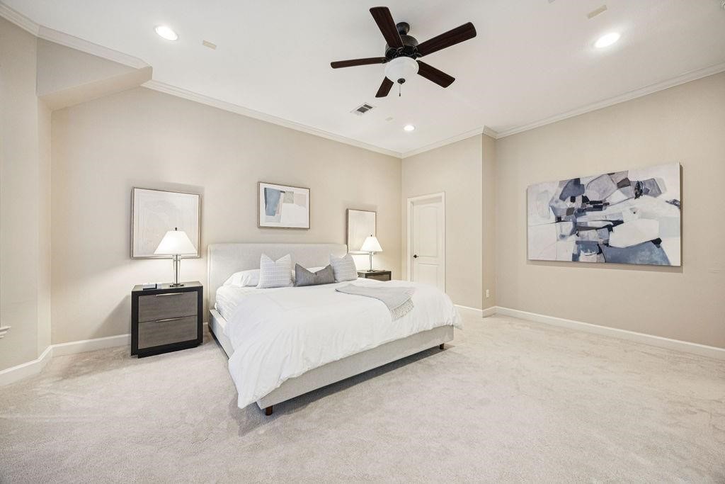 5407 Lillian Street Houston, TX 77007 - Photo 20 of 38 a spacious bedroom with a bed and painting on the wall